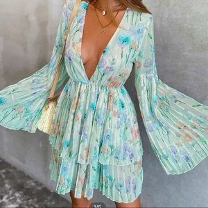Plunging neck pleated floral dress